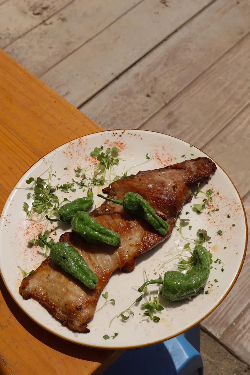 Iberian pork secreto with Padrón peppers